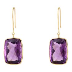 This is part of Chairish’s Fine Jewelry assortment.  Indulge in elegance with these 18K yellow gold dangle earrings featuring captivating octagon-cut amethyst gemstones. The rich purple hue of the amethysts is complemented by the timeless allure of yellow gold, creating a stunning accessory that effortlessly elevates any look. Perfect for adding a touch of sophistication to both casual and formal attire. Amethyst encourages self-control and citrine has strong vibration energy which helps promote Luxury Octagon Gemstone Earrings, Elegant Octagon Earrings For Formal Occasions, Classic Octagon Gemstone Earrings, Formal Octagon Gemstone Earrings, Elegant Octagon Gemstone Earrings, Modern Octagon Earrings For Formal Occasions, Luxury Rectangular Gemstone Earrings, Elegant Rectangular Earrings With Gemstone Accents, Elegant Rectangular Gemstone Accented Earrings