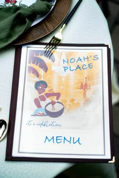 a plate with a fork and knife on it next to a sign that says noah's place