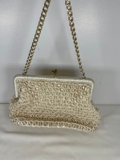 Please read full description below and see all photos! Fantastic, Mid Century 1960's Cream/off white raffia and bead sweet evening purse with metal chain strap and kiss-lock.  Super cute and in excellent condition! Made in Japan (with tag inside) and lined - the lining has a few age spots.   Outside is in excellent condition - no holes or tears or stains. 6" tall 8.5" long 2" deep Please convo me for more information or photos! Please like my shop for all the latest vintage finds!  I post often! Vintage Party Clutch With Pearl Handle, Cream Woven Evening Bag, Vintage Formal Clutch With Pearl Handle, Vintage Pearl Handle Clutch Evening Bag, Vintage Clutch Evening Bag With Chain Strap, Vintage Evening Clutch With Chain Strap, Vintage Evening Clutch With Pearl Handle, Handmade Cream Clutch For Party, Handmade Cream Evening Bag