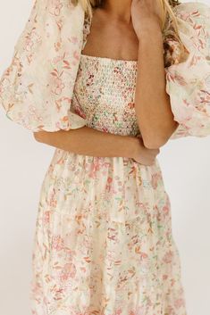 this vintage-inspired puff sleeve midi dress is a zoco hunny essential. featuring a soft spring floral pattern with a slimming smocked bodice + dreamy puff sleeves, it’s the perfect formal dress for brunch dates, garden parties, + bridal showers. pink + sage floral // midi length, square neck, smocked, puff sleeve, pockets, back zipper, fully lined, organza model is 5'8" + wearing a small measurements are approximate + taken while laying flat small : bust 34” (smocked) length 48” medium : bust 3