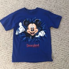 Royal Blue Mickey Mouse T-Shirt New Without Tags Size Youth Medium Never Worn From A Smoke Free Home Mickey Mouse Graphic Tee Tops, Cute Blue T-shirt With Cartoon Print, Blue Graphic Tee With Character Print, Blue Mickey Mouse Short Sleeve Tops, Blue Character Print Graphic Tee, Blue Mickey Mouse Playful T-shirt, Casual Blue Shirt With Cartoon Print, Playful Blue Mickey Mouse T-shirt, Blue Short Sleeve Tops With Mickey Mouse