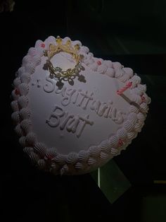 there is a cake that says congratulations but with a crown on top