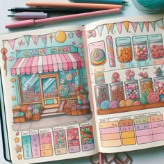 an open notebook with candy store pictures on it