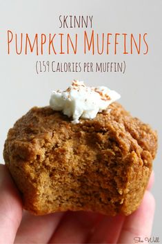 a close up of a person holding a muffin in their hand with the words skinnyy pumpkin muffins on it