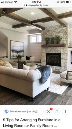 a living room filled with furniture and a fire place in the middle of a room