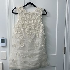 Excellent Condition, Only Wore Once As My Change Into Dress For My Wedding. Perfect For Anything Bridal! Has Elegant String Ties In The Back With Floral Appliqus. Size 2. Purchased At Neiman Marcus. Embellished Fitted Dress For Ceremony, Fitted Embellished Dresses For Ceremony, Ceremony Fitted Embellished Dress, White Sleeveless Dress For Ceremony, Sleeveless Embellished Lace Wedding Dress, White Embellished Dress For Ceremony, Chic Floral Embroidered Mini Dress For Wedding, Chic Floral Embroidery Mini Dress For Wedding, Fitted Sleeveless Ceremony Dress