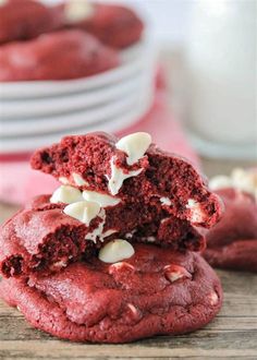 red velvet cookies stacked on top of each other with white chocolate chips and marshmallows