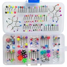 a plastic container filled with lots of different types of hair pins