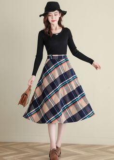 "★★ FEATURES * Wool skirt * Polyester lining * Two side seam pockets * Right zipper closure * back elastic band * Plus size full skirt * A Line Skirt * Perfect for Winter, autumn * Dry clean ★★ The model is 170 cm (5′ 7″) tall with a 80 cm (31.5\") bust, 66 cm (26\") waist. She is wearing the wool plaid skirt in size XS. ★★ Please select custom order according to the follow situation Your height is not between 155 cm- 172 cm Your weight is over 75 kg Request the length ★★ Get your size in Size C Retro A-line Winter Skirt, Retro Winter Skirt, Plaid A-line Skirt With Lining, Brown A-line Winter Skirt, Beige A-line Skirt For Fall, Fall Beige A-line Skirt, Retro Winter Midi Skirt, Vintage Long Skirt For Winter, Winter Retro Pleated Skirt