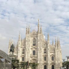 the large cathedral has statues on it's sides