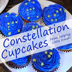 blue frosted cupcakes sitting on top of a white plate with the words, constellation cupcakes from helping little hands