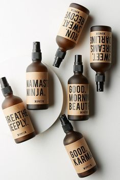 five bottles of good morning beauty products on a white surface with the words good morning written in black