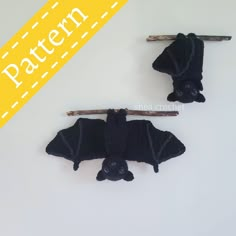 two knit bats hanging from clothes pins with the words pattern below them that says,