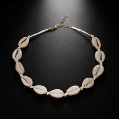 "Upgrade your beach look with our stunning Cowrie Shell Hoop Earrings. Crafted from real cowrie shells, these earrings are perfect for your next vacation. Bring a touch of coastal charm to any outfit with these unique and stylish hoops."Pair them with the Cowrie Shell Necklace,and your outfit is complete!