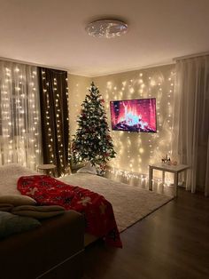 a living room decorated for christmas with lights on the walls and a tree in the corner