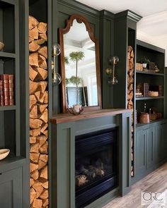 a fireplace with bookshelves and a mirror above it