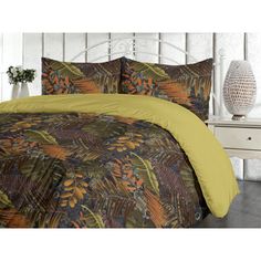 an image of a bed with yellow comforter and matching pillowcases on it