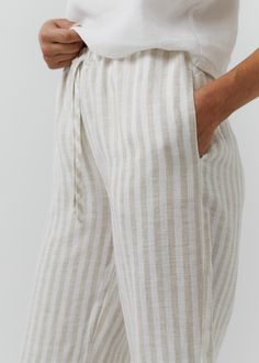 Stay stylish and comfortable with these striped linen pants, featuring a high-waisted elastic band, adjustable drawstring, and deep pockets. Made from breathable, lightweight linen, they're perfect for casual outings, lounging, or warm-weather days. A versatile wardrobe essential for effortless charm and practicality. READY FOR GIFT!  ✨ Gift message available (please write the message in the comments field).   All packages are packed in our original eco-friendly white boxes made from recycled pa Striped Linen Pants, Pants Elastic Waist, Womens Trousers, Versatile Wardrobe, Womens Casual, Gift Message, Striped Linen, Pure Linen, Linen Pants