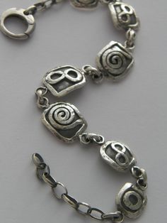 "Hand Made Hammered .925 Sterling Silver Oxidized Bracelet with Infinity and Sun Simbol Adjustable from 7\" to 9\" I hand made this Unique Bracelet from .925 Sterling Silver with soldered elements and links. Details: Width:16 Grams(11 Dwt.) Wide:12.50 mm(0.49 inches or 1/2 inches) Stamped-Handcrafted,.925 Length:Adjustable from 7 inches up to 9 inches Clasp-13 mm Round Lobster Clasp The Bracelet comes in a Free gift poush and gift box" Adjustable Spiral Jewelry With Oxidized Finish, Modern Adjustable Bracelet Stamped 925, Modern Adjustable 925 Stamped Bracelets, Modern Adjustable 925 Stamped Bracelet, Adjustable Hand Forged Sterling Silver Bracelet, Hand Forged Adjustable Sterling Silver Bracelet, Adjustable Sterling Silver Bracelet Stamped 925, Oxidized Bracelet, Sun Symbol