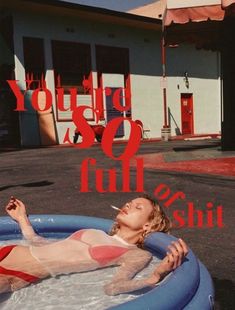 a woman laying in an inflatable pool with the words you're so full on it