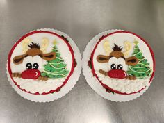 two christmas cupcakes decorated with reindeer faces