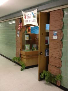 an entrance to a library with books on the shelves and plants growing out of it