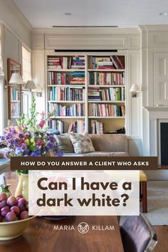 a living room filled with furniture and books