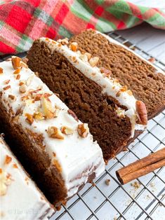 two slices of carrot cake on a cooling rack