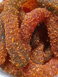 a close up view of some food in a plastic container with seasoning on it