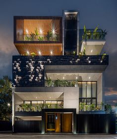 the building has plants growing on it's roof and balconies over its windows