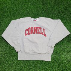 Vintage Cornell Sweatshirt Womens Small 19x21 Gray Show your school spirit with this Vintage Cornell Sweatshirt in gray, Women's Small. Perfect for a classic collegiate style!  * Used condition  * Length is on the shorter side  * No rips/holes  * No stains  * Normal fading from washing  * Normal cracking on the graphic VINTAGE CORNELL SWEATSHIRT, WOMENS SMALL SWEATER, GRAY COLLEGE SWEATSHIRT, RETRO UNIVERSITY APPAREL, 90S VINTAGE CLOTHING, WOMENS 19X21 SWEATSHIRT, CLASSIC CORNELL UNIVERSITY SWEA Collegiate Pre-shrunk Sweatshirt For College, University Logo Cotton Sweatshirt Fan Gear, University Logo Cotton Sweatshirt For Fans, University Logo Cotton Sweatshirt For Fan Gear, Gray Crew Neck Top For Campus, Collegiate Sweatshirt With University Logo, Sports University Logo Cotton Sweatshirt, Collegiate Crew Neck Sweatshirt In Athletic Heather, College Team Spirit Sweatshirt In Athletic Heather