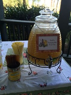 a honey jar sitting on top of a table