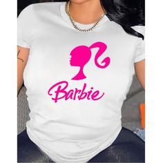 The Barbie Pink Round Neck T-Shirt Is A Classic Fit, Short Sleeve Tee With A Polyester, Spandex , Modal Blend Fabric. It Features A Rib-Knit Round Neck, Straight Hem, And Signature Barbie Graphics On The Front. This T-Shirt Is Perfect For Any Casual Outing Or To Show Your Love For Barbie. Lightweight, Classic Fit, Double-Needle Sleeve And Bottom Hem Polyester, Spandex, Modal Trendy White Stretch Shirt, Friends Tee, Custom Tee Shirts, Pink Round, Workout Tee, Pink Fashion, Casual T Shirts, Polyester Spandex, Custom Shirts