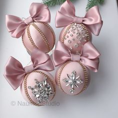 pink ornaments with bows and jewels on them