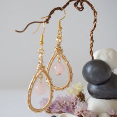 Feel the love with the energies of these uniquely crafted rose quartz earrings. Our rose quartz earrings are known for: HANDMADE ORIGINAL DESIGN - We customize each rose quartz earring to the unique shape of its stone. This process makes your drop earrings truly one of a kind. AUTHENTIC CRYSTALS & ALLERGY FREE MATERIALS - Your rose quartzes are authentic and natural. Our artists sort through hundreds of rose quartzes to find yours. We only use nickel-free, lead-free and allergy-free metals for y Rose Quartz Drop Earrings For Jewelry Making, Rose Quartz Earrings With Ear Wire As Gift, Rose Quartz Ear Wire Earrings For Gift, Rose Gold Dangle Earrings With Rose Quartz, Rose Quartz Teardrop Earrings For Gift, Rose Gold Rose Quartz Drop Earrings, Rose Quartz Drop Earrings Gift, Elegant Rose Quartz Drop Earrings, Handmade Rose Quartz Dangle Earrings