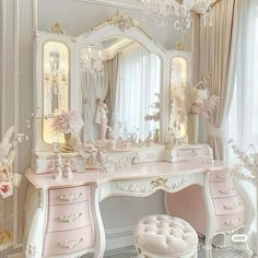 a white dressing table with a pink vanity and stool next to a large chandelier