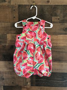 "Jump into summer with a fresh slice of watermelon! Adorable, comfortable, and soft baby romper for your precious little love! Made of 100% cloth cotton, it is washable and durable for hours of baby fun. The soft elastic leg gently wraps around the baby's upper thigh. Soft plastic snaps located on the inseam and straps make for easy changes. (Not designed for sleepwear) Rompers are made of 100% cotton (unless otherwise indicated) and are machine washable in warm water. Fabrics were all washed an Romper Summer, Disney Fabric, First Birthday Party Themes, Short Romper, One In A Melon, Toddler Romper, Knitted Romper, Bubble Romper, Soft Plastic