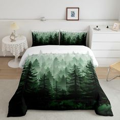 a bed room with a neatly made bed and green trees on the comforter cover