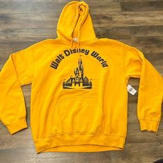 Disney Parks Walt Disney World Hooded Sweatshirt Size Medium 50% Cotton 50% Polyester Brand New With Tags Disney Gold, Disney Tops, Disney Parks, Walt Disney World, Blue Gold, Hooded Sweatshirt, Walt Disney, Disney World, Hooded Sweatshirts