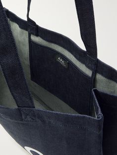 A.P.C.'s tote bag is made from sturdy denim that'll hold both weekly groceries and lighter cargo with ease. It's printed with a flipped version of the brand's initials and has an internal pocket to keep your wallet, keys and phone within easy reach. Luxury Denim Tote Bag, Rectangular Denim Blue Bag For On-the-go, On-the-go Denim Blue Canvas Shoulder Bag, Eco-friendly Blue Denim Bag, Denim Blue Tote Shoulder Bag For On-the-go, Porter Bag, Denim Tote Bags, Denim Tote, Purple Bags