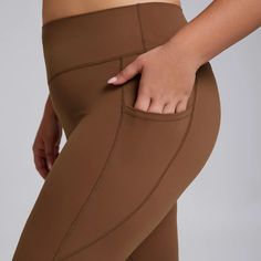 Upgrade your workout wardrobe with the B|FIT DELUXE Leggings. These high-waisted leggings provide extreme comfort while also sculpting your figure. With a convenient pocket feature, you can easily carry your essentials on-the-go. Stay stylish and supported during any fitness routine. Brown Compressive Activewear For Gym, Brown Compression Activewear For Workout, Sporty High-stretch Brown Yoga Pants, Brown High Stretch Sporty Yoga Pants, Brown Athleisure Leggings For Yoga, Sporty Brown Yoga Pants, Brown Compressive Leggings For Yoga, Brown Compressive Yoga Leggings, Compressive Brown Leggings For Yoga