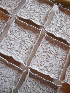 some white lace doily sitting on top of a table