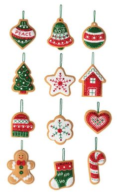 christmas ornaments hanging from strings on a white background