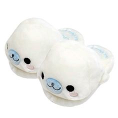 two white stuffed animals with blue eyes