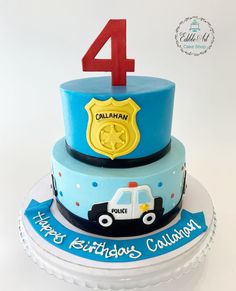 a birthday cake for a four year old boy with a police car on the top