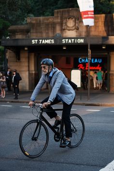 a man riding a bike across a street