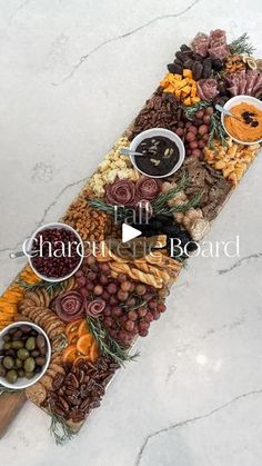 a platter filled with lots of different types of food on top of a table