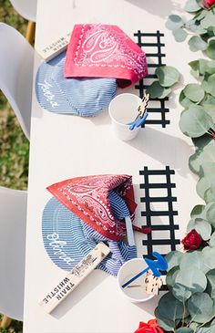 the table is decorated with red, white and blue umbrellas on it's side