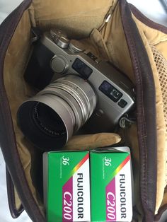 two batteries and a camera in a bag