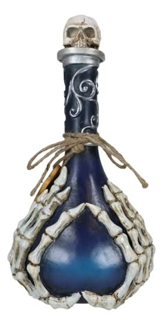 a blue glass bottle with a skull on it's cap and rope around the neck